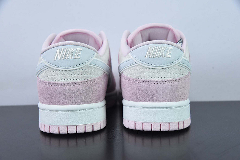 the nike dunk low appears in pink and grey suede dv3054-600